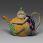 Majolica pottery tea pot in the shape of a monkey