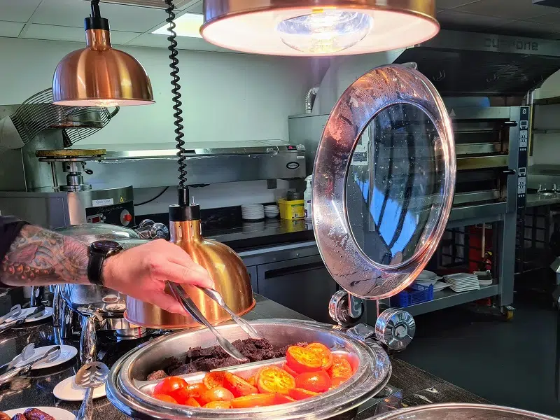 Breakfast serving dish with warm tomatoes at the Holiday Inn Winchester