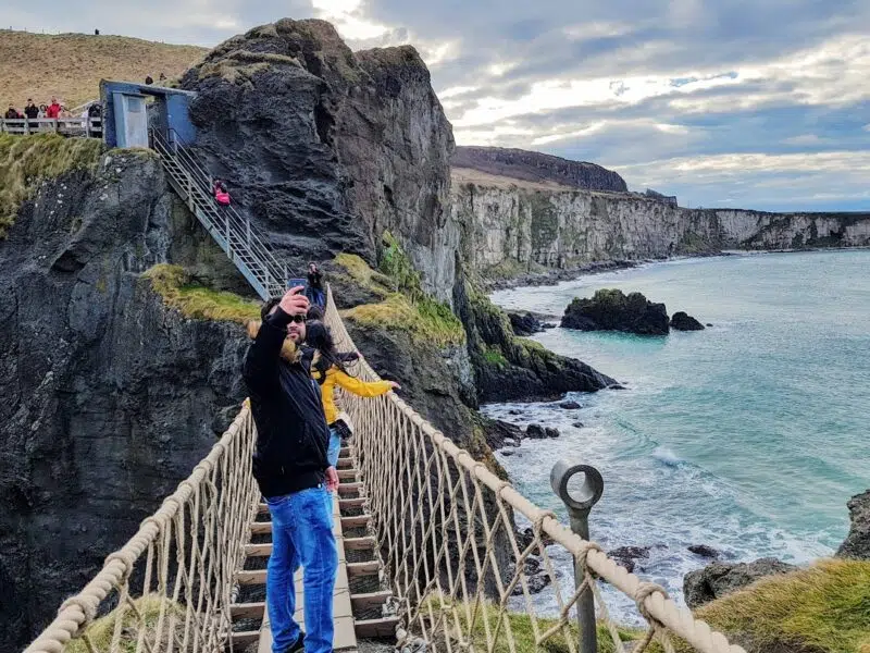 Selfie as walking across the rope bridge. Just one of the best places to visit in Northern Ireland