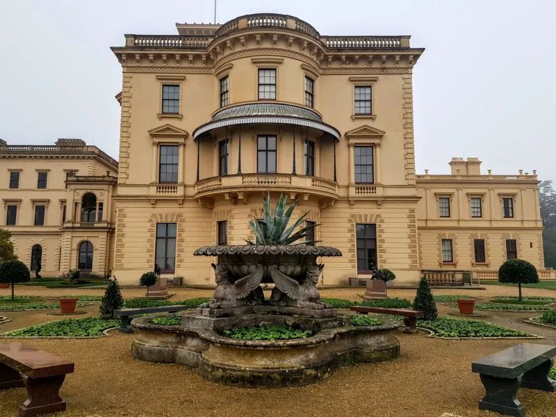 The cream coloured Osborne House behind a large fountain in the foreground