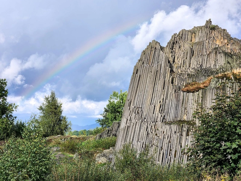 Panska skala rock formation with rainbow overhead