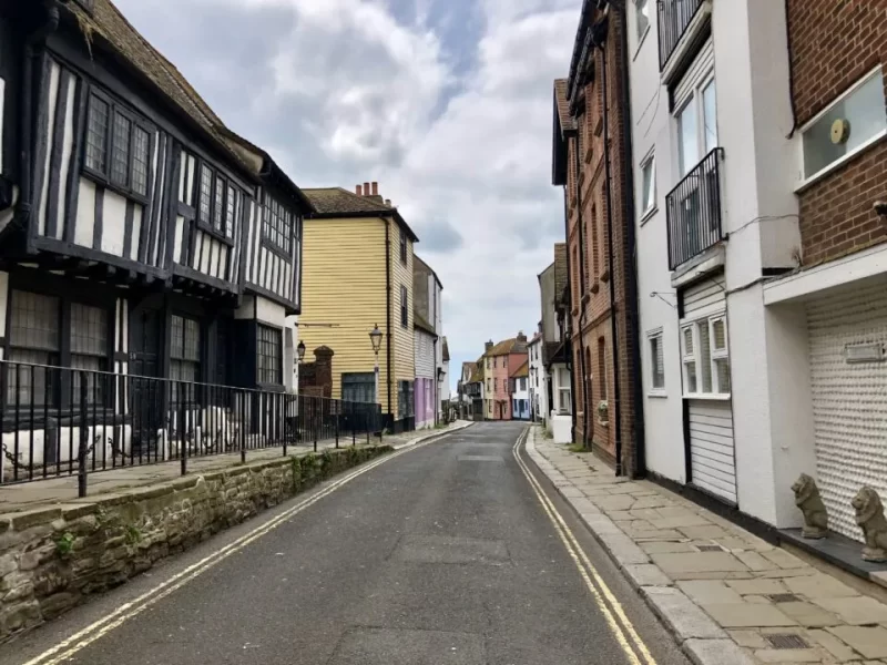 Street with Tudor-style house to the left. Just one of many places for a day trip in London.