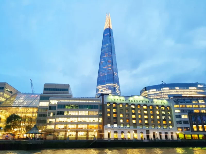Exterior view of The Shard during the evening where the lights are on set against a dark blue sky