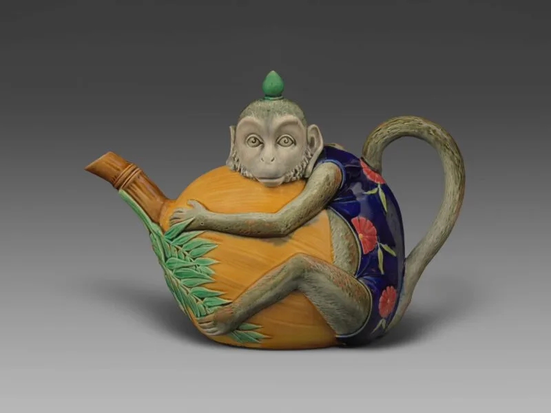 Majolica pottery tea pot in the shape of a monkey
