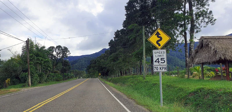 Signs by the road spotted from our Car rental in Belize