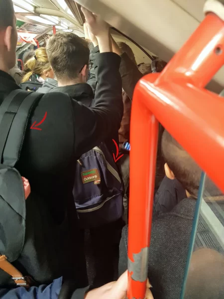 Busy Central Line in London in peak hour. Be aware of the tube etiquette and removed your backpacks
