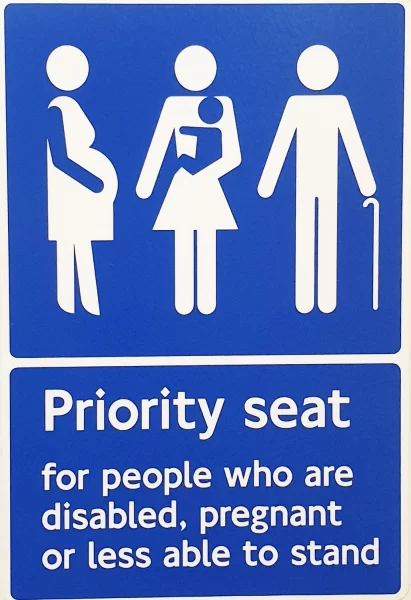 Priority seats for the London Underground are indicated by blue signs 