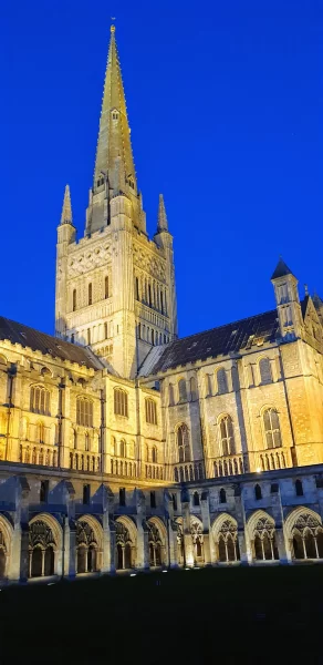 Norwich Cathedral at dusk, just one of the many amazing things to see during a weekend in Norwich. 