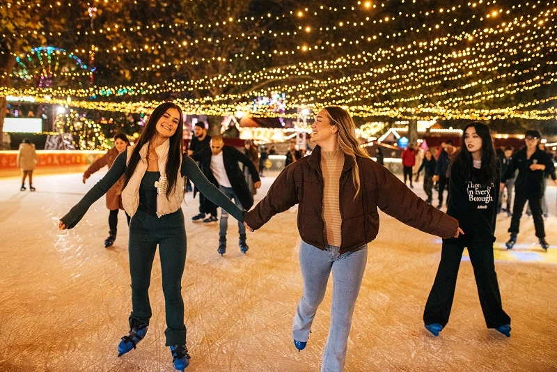 Ice skating rink filled with people. 