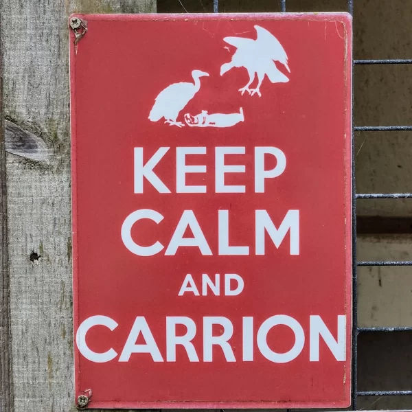 Red sign at the National Centre for Birds of Prey that reads "Keep Calm and Carrion"