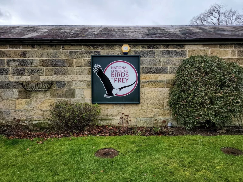 The main sign of the National Centre for Birds of Prey at the entrance