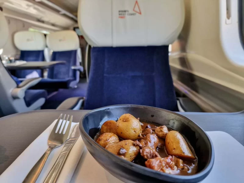 A meal of braised beef aboard Avanti West Coast in the First Class cabin.