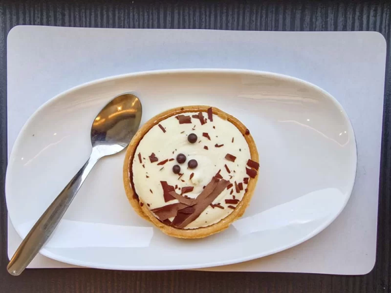 a chocolate and vanilla tart served in First Class aboard Avanti West Coast