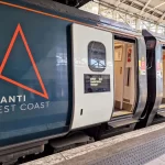 Exterior of Avanti West Coast train carriage showing logo