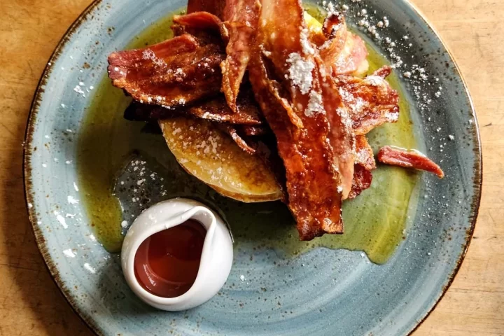 Pancake stack with streaky pancake on table at Lutt and Turner in Malton