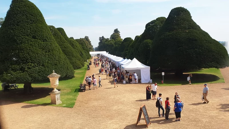 Row of food tents at the Hampton Court Palace food festival on the August bank holiday weekend