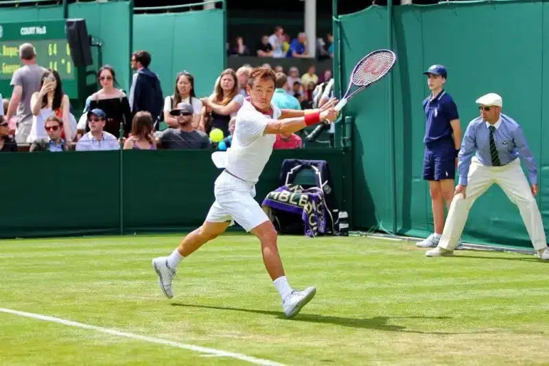 Action shot captured at Wimbledon. Photo by T. Lam