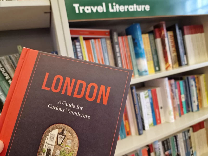 Close up of London book against travel literature bookshelf