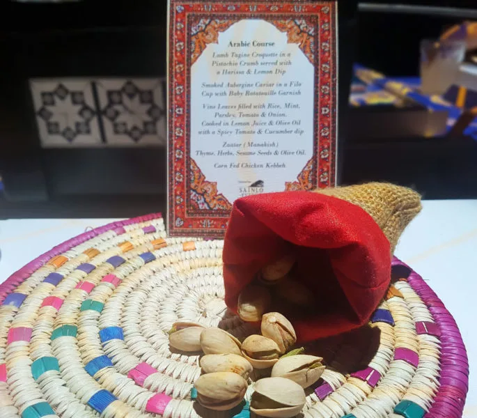 A plate of pistachios at the Le Petit Chef dining experience