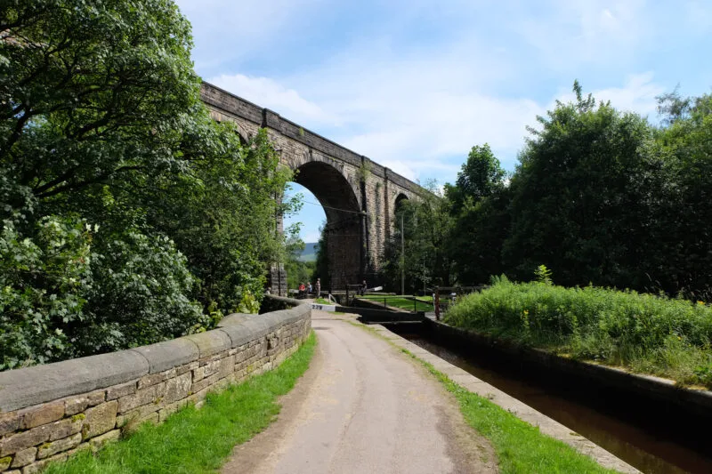 A path leading to a large bridge